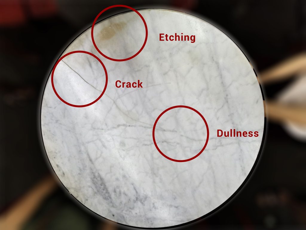 Unpolished heavy-duty used marble dining table without proper care.